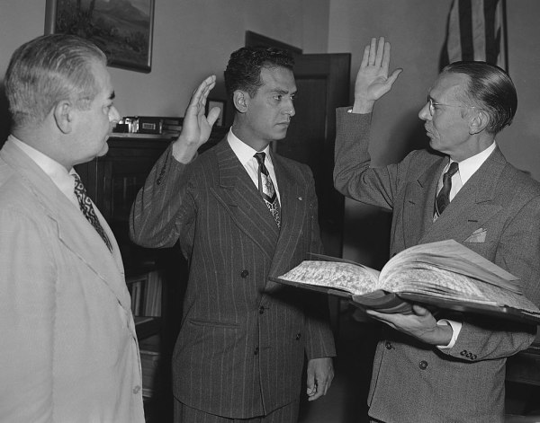 Edward Roybal is sworn in as the first Mexican-American councilman for the City of Los Angeles, 1946. Also present in the photo are Edward Davenport and Walter C. Peterson / Los Angeles Daily News (licensed under the Creative Commons Attribution 4.0 International license)