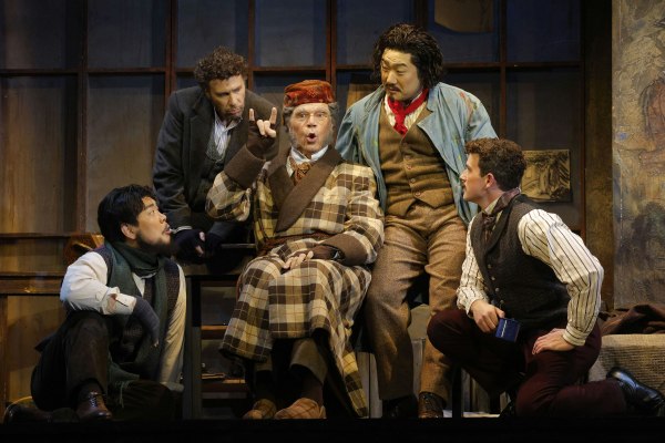 Rod Gilfry (center) as Benoit, with (left to right) William Guanbo Su as Colline, Oreste Cosimo as Rodolfo, Gihoon Kim as Marcello and Emmett O'Hanlon as Schaunard in LA Opera's 2025 production of La Bohème. Photo: Cory Weaver.