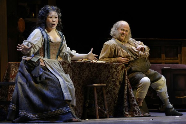 Hyona Kim as Mistress Quickly and Craig Colclough as Sir John Falstaff