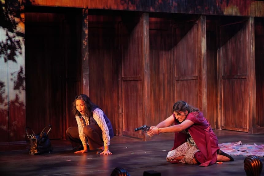 Joan Almedilla (L) as Sara Jane Moore and Astoncia Bhagat Lyman (R) as Lynette "Squeaky" Fromme in ASSASSINS at East West Players. Photo by Steven Lam.
