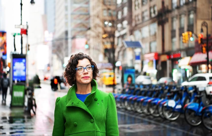 Fernanda Santos, pictured walking in New York City’s theater district, never imagined that her name would be on a billboard in Times Square. She moved to Boston from Brazil in 1998 to attend graduate school at Boston University. Her plan was to return to Brazil and get a job at a newspaper, but instead she stayed for an internship that changed the course of her life. Photo by Mariela Murdocco for palabra.