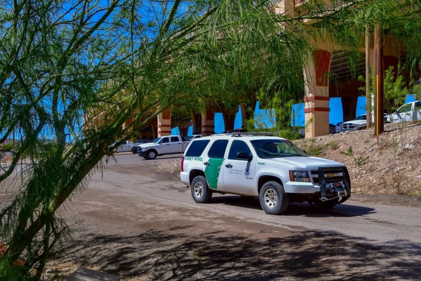 A Border Patrol vehicle along a fence between Mexico and the U.S. in El Paso, Texas. Photo via Shutterstock