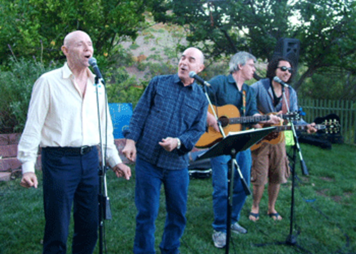 Musicians Tom English, Brad Parker, Larry Dilg, and Keaton Simmons.