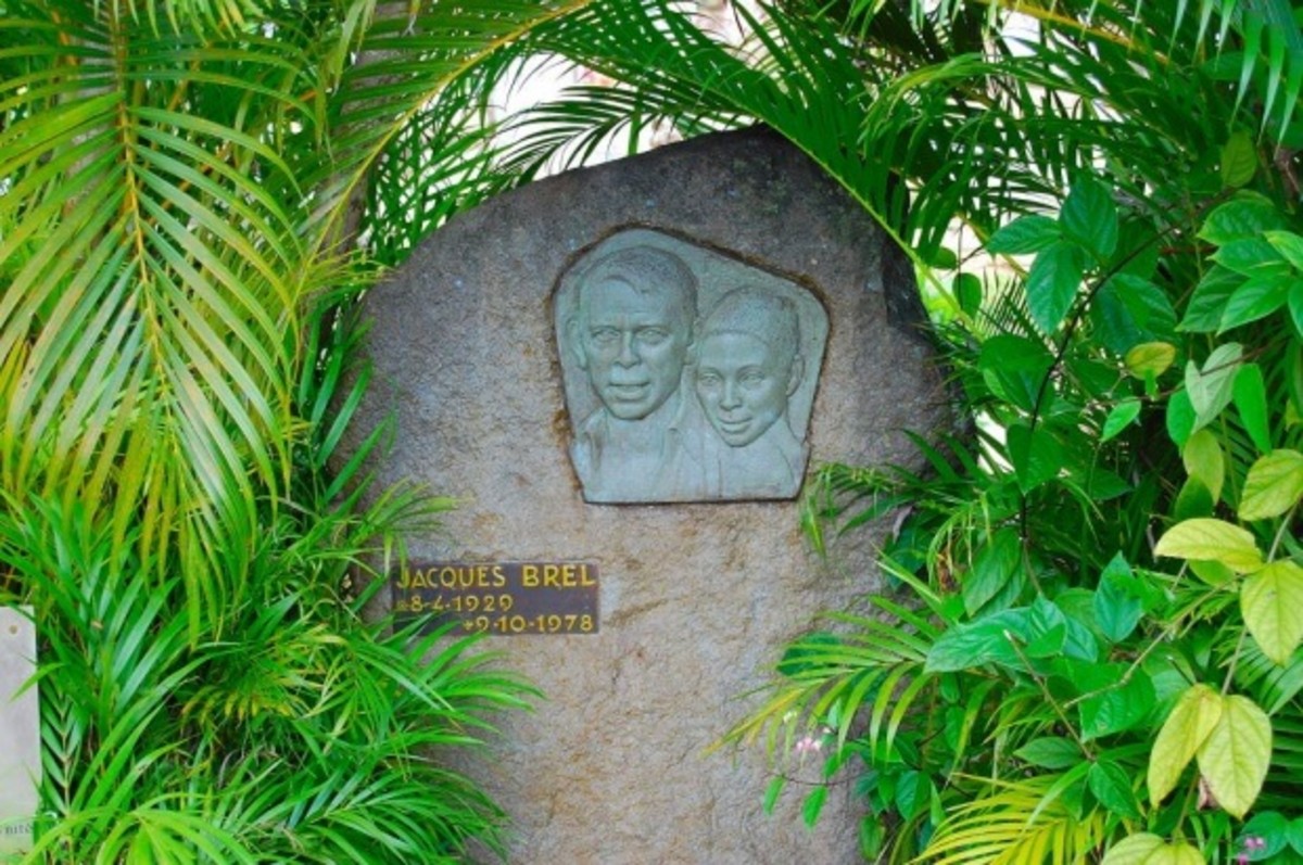 The headstone of Jacques Brel's grave includes a plaque of the troubador and his lover, Maddly Bamy, of the Caribbean.
