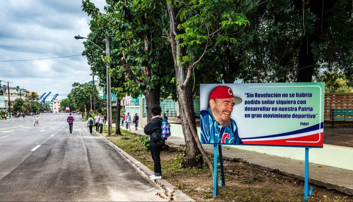 A billboard in Havana featuring the late Fidel Castro, himself once a promising baseball talent, saying, “Without Revolution, it would not have been possible to ever dream of developing a great sports movement in our country.” Photo by Sandra Foyt via Shutterstock