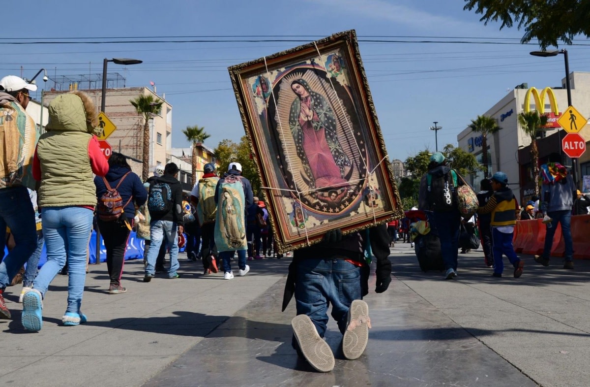 In Mexico City, one of millions of annual pilgrims crawls on his knees toward the Basilica de Guadalupe. Photo by Angela Ostafichuk via Shutterstock