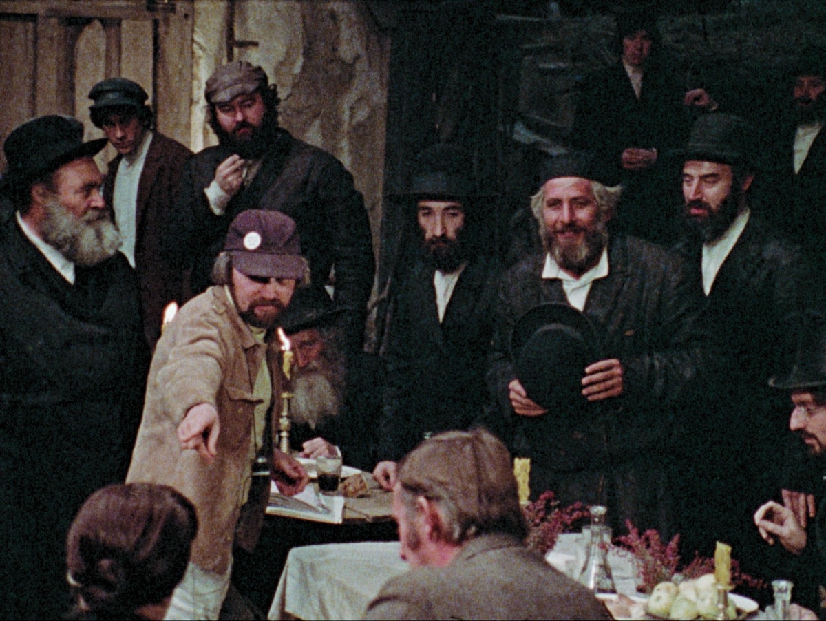 Director Norman Jewison (pointing) and star Tevye (holding hat) on the set of The Fiddler on the Roof.