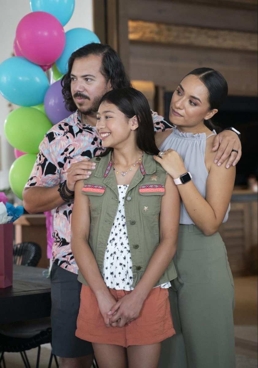 Bobby Gonzalez (George Garcia) Nitzia Chama (Ana Garcia) and Maeve Garay (Victoria Garcia) enjoy a family celebration. Photo Courtesy of HBO Max